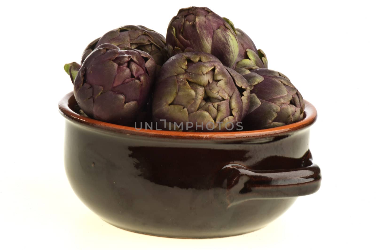 small exotic artichoke on white background