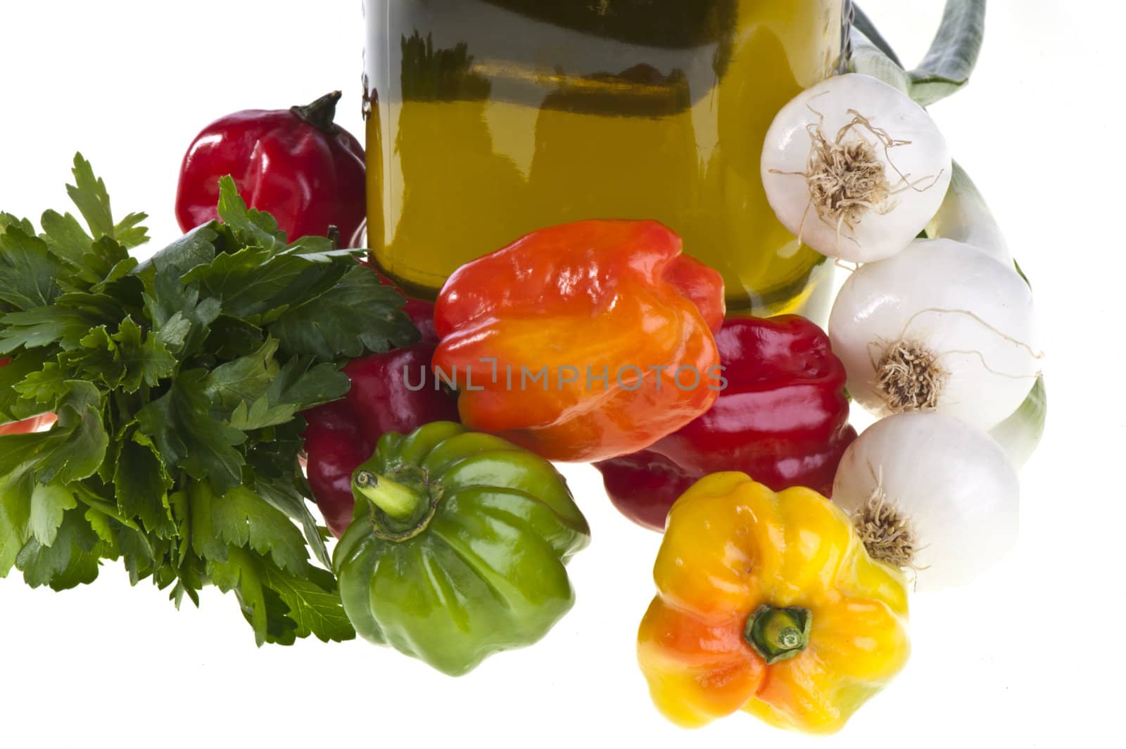 some small exotic peppers on white background