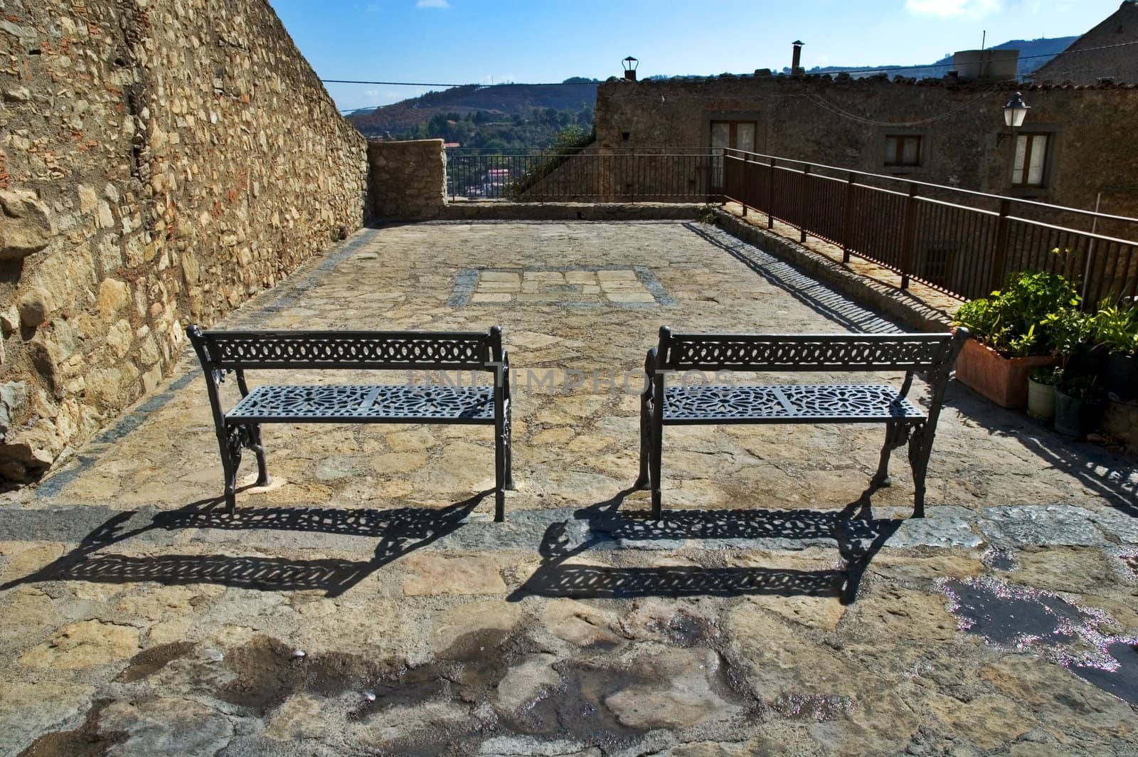 Two iron benches on Italian terrace