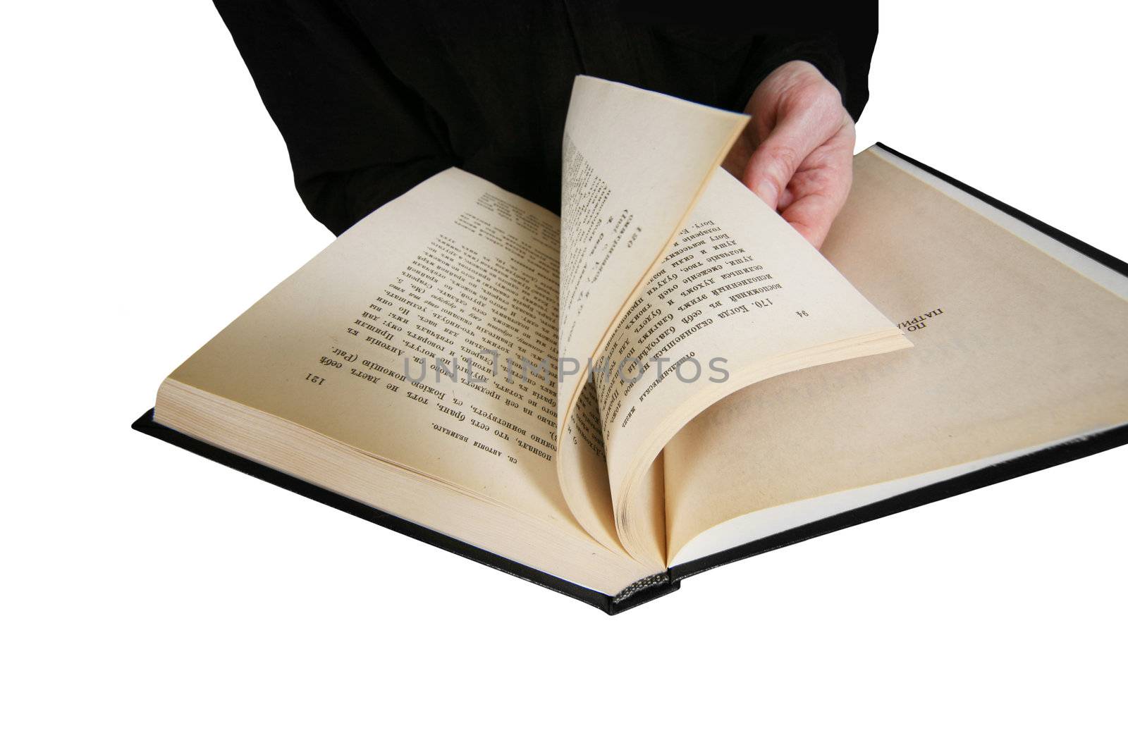 The male hand holds the open book