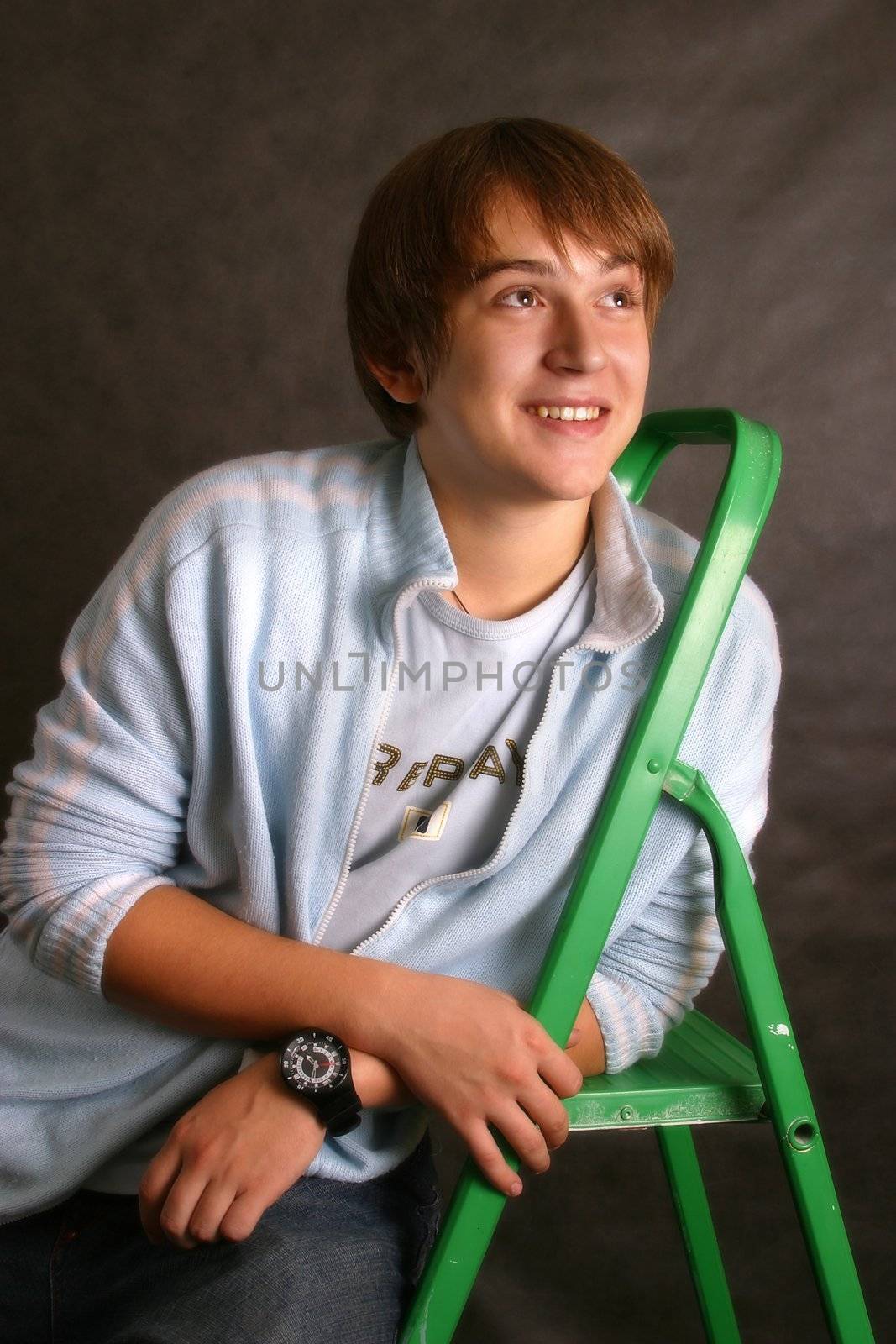 The young man with a green step-ladder