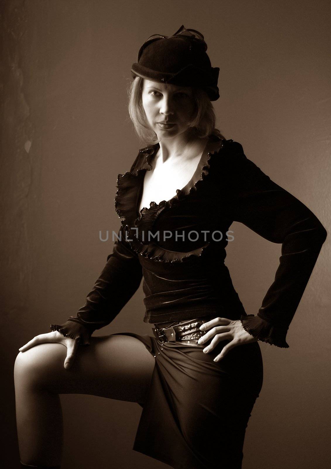 Portrait of the woman in a hat in style of a retro