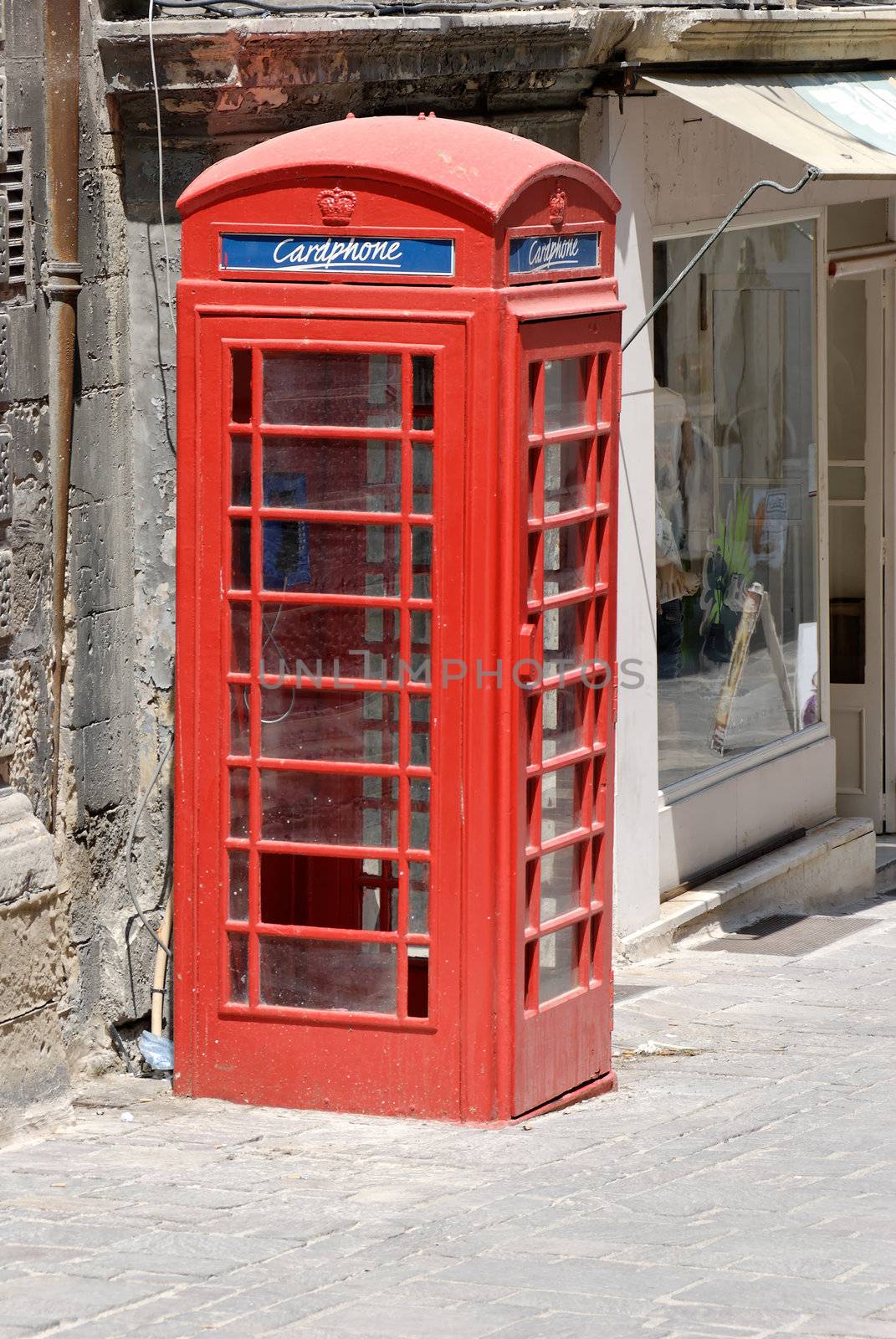 Red telephone booth in Valletta, Malta. The Maltese heritage from the British Empire.
