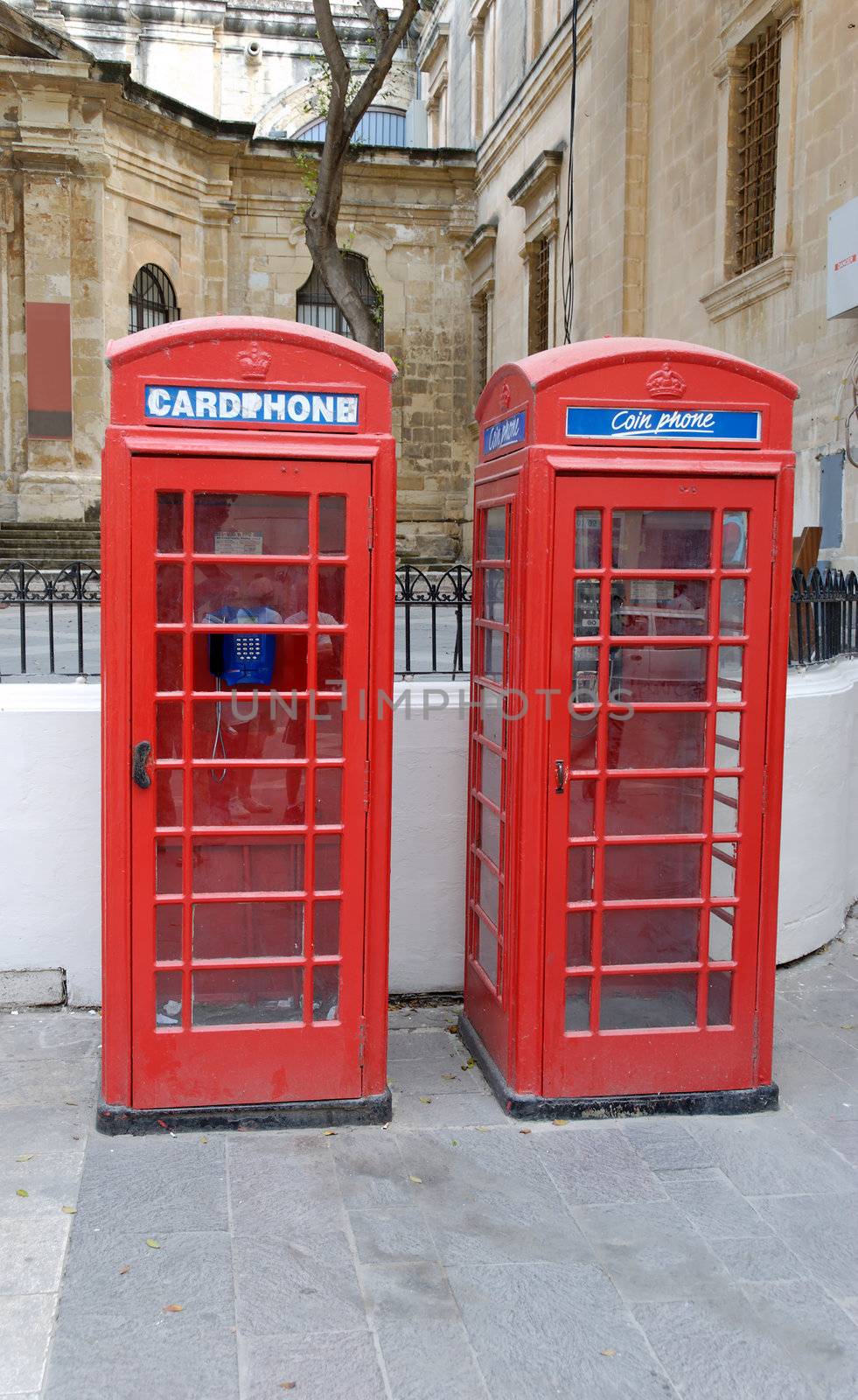 Two red telephone booths in Valletta, Malta near St.Johns Co-Cathedral. The Maltese heritage from the British Empire.
