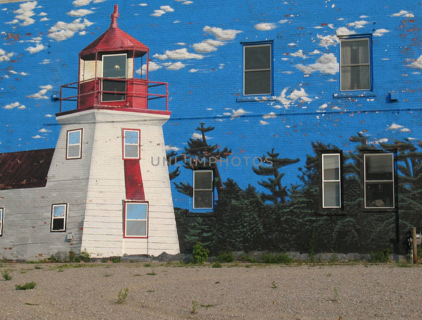 This image is on a mural of a lighthouse scene on the side of a building