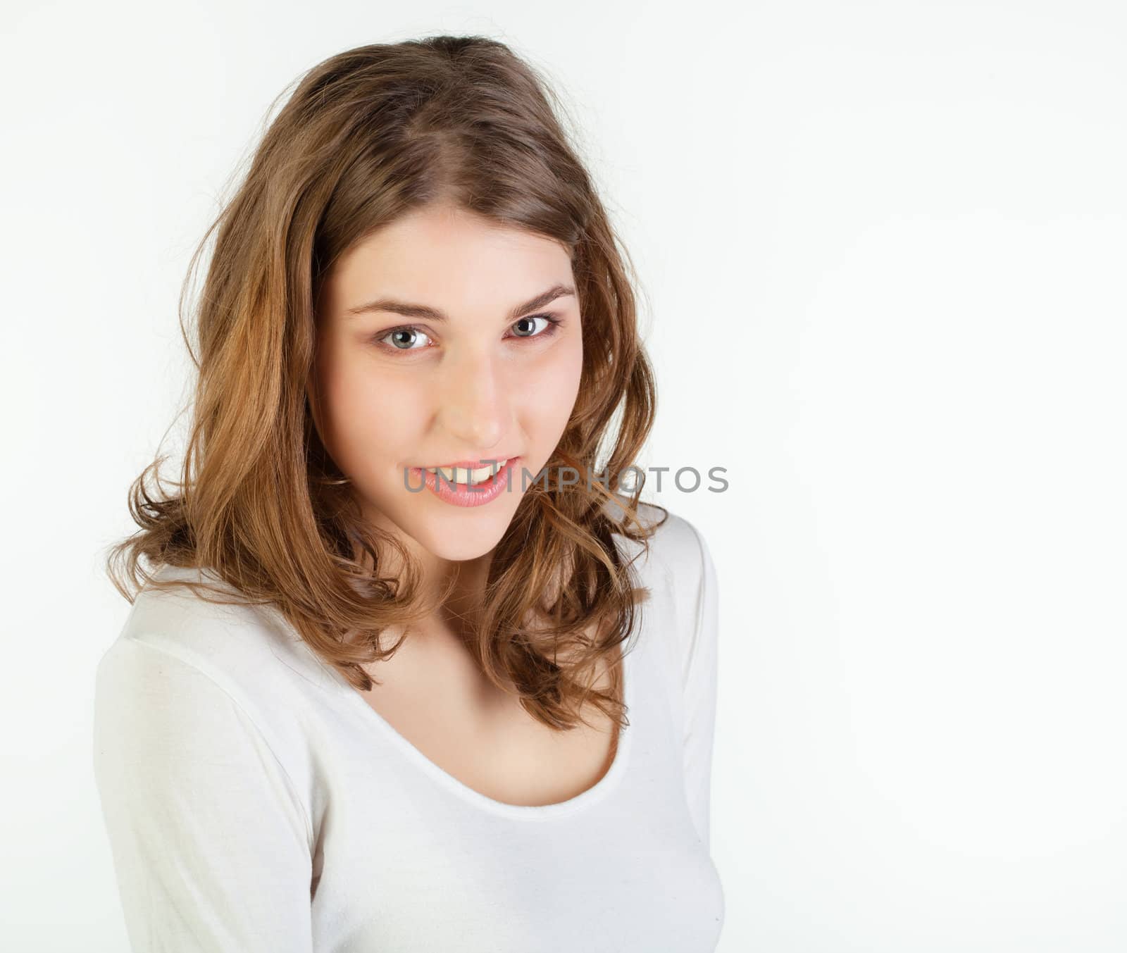 Portrait of pretty young woman against white background