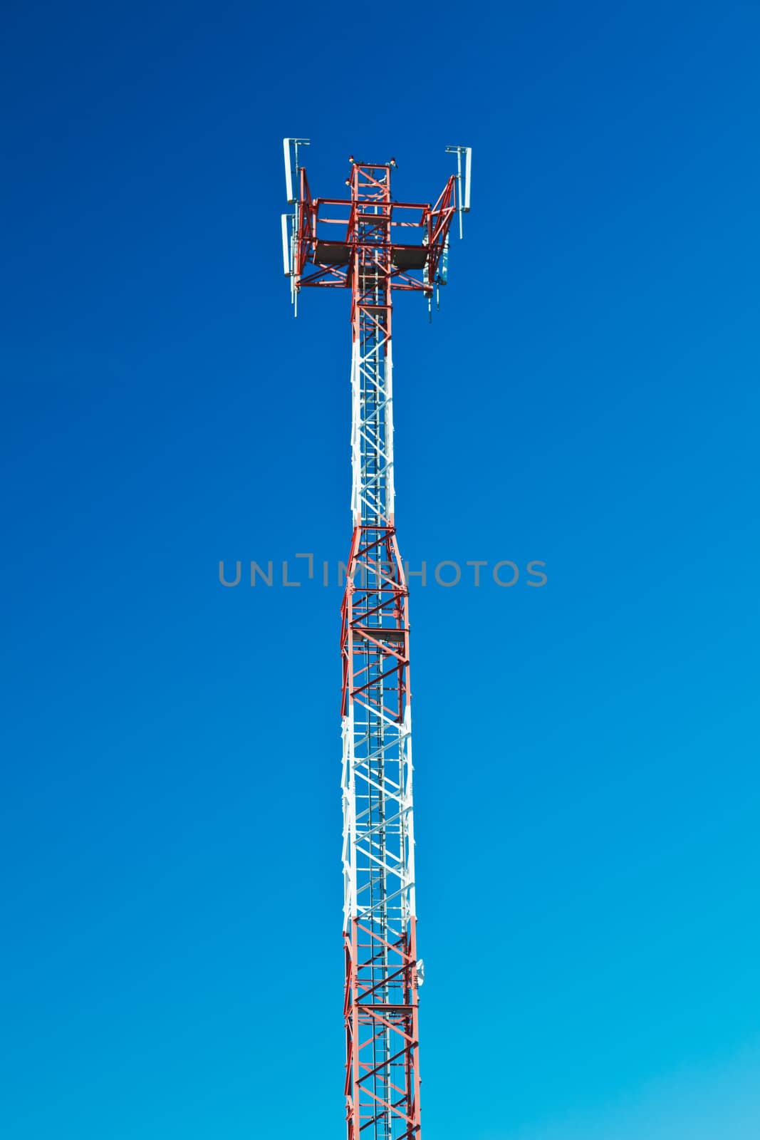 Communications tower with a beautiful blue sky