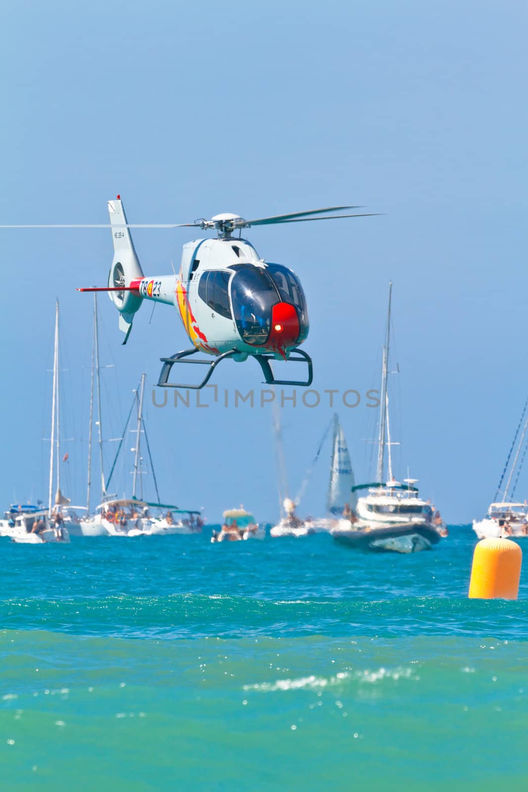 CADIZ, SPAIN-SEP 11: Helicopters of the Patrulla Aspa taking part in an exhibition on the 4th airshow of Cadiz on Sep 11, 2011, in Cadiz, Spain