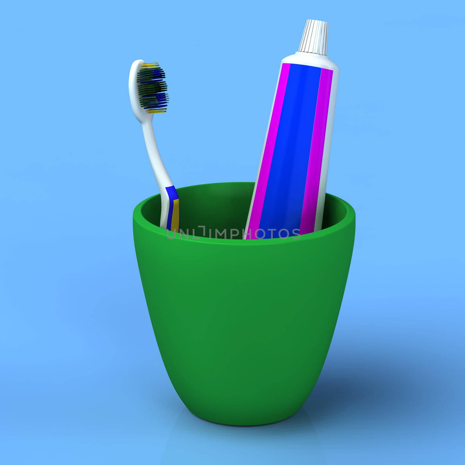 Toothbrush and gel toothpaste in  green cup by vetdoctor