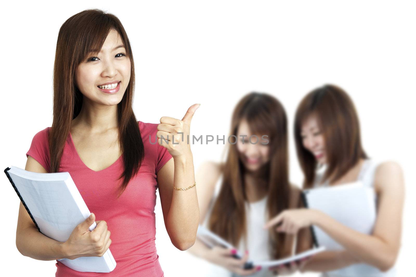 Female student thumbs up with great smile.