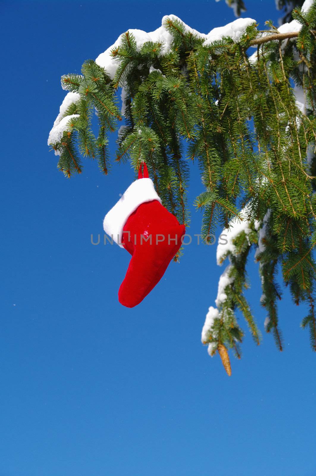 Santa Claus Christmas boot for gifts outside in a snowy landscape