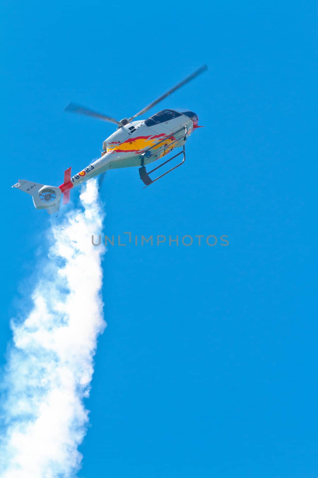 CADIZ, SPAIN-SEP 11: Helicopters of the Patrulla Aspa taking part in an exhibition on the 4th airshow of Cadiz on Sep 11, 2011, in Cadiz, Spain