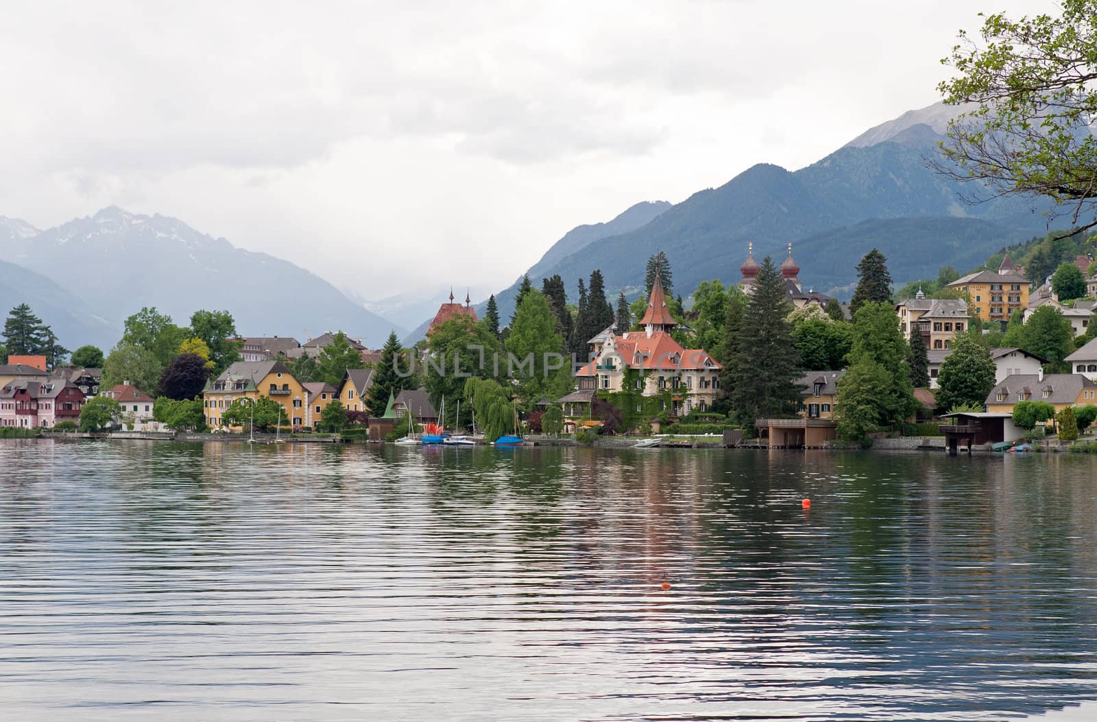 Beautiful summer Alpine lake and town in mountains view (Austria)