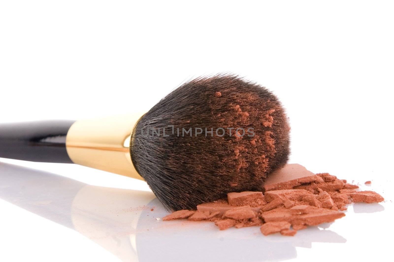 Make-up brush and brown powder isolated on white background