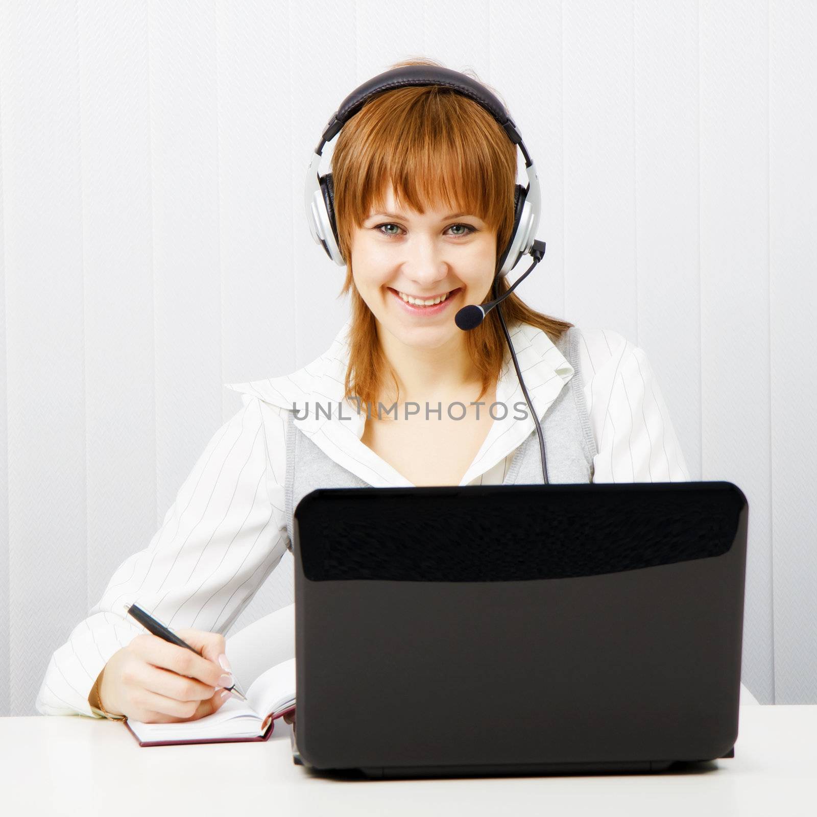 girl in headphones with a microphone. Worker Hotline
