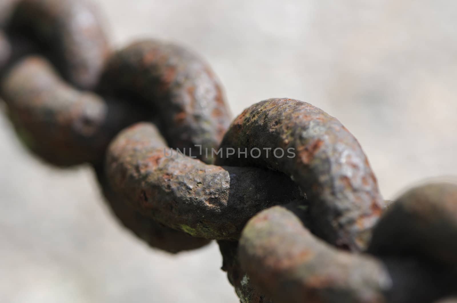 Extreme close-up of a rusted chain with big links by shkyo30