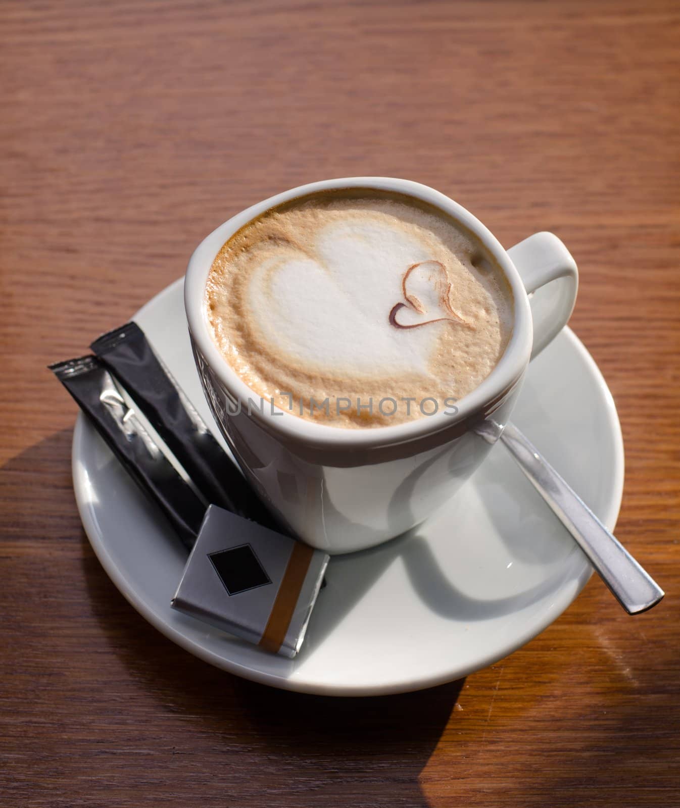 Cappuccino coffee cup closeup at the table