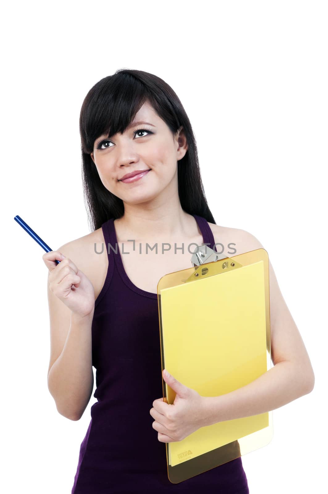 Portrait of a beautiful young Asian woman holding clipboard and pointing pen over white background.