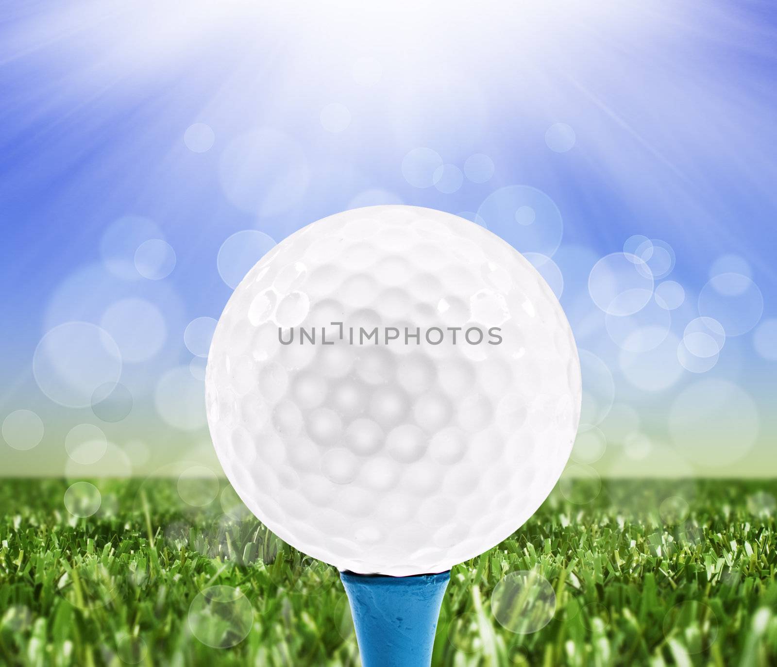 Spring background with a golf ball on a peg by tish1