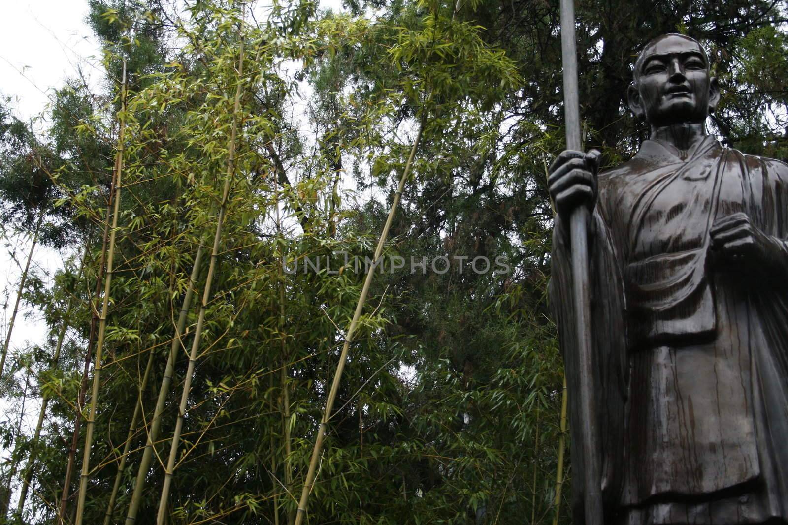Statue in the bamboo forest at the temple of the w by koep
