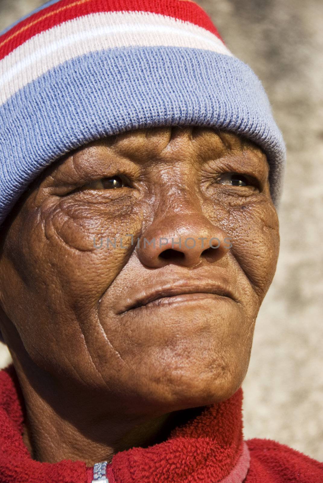 Old African woman against a grunge background