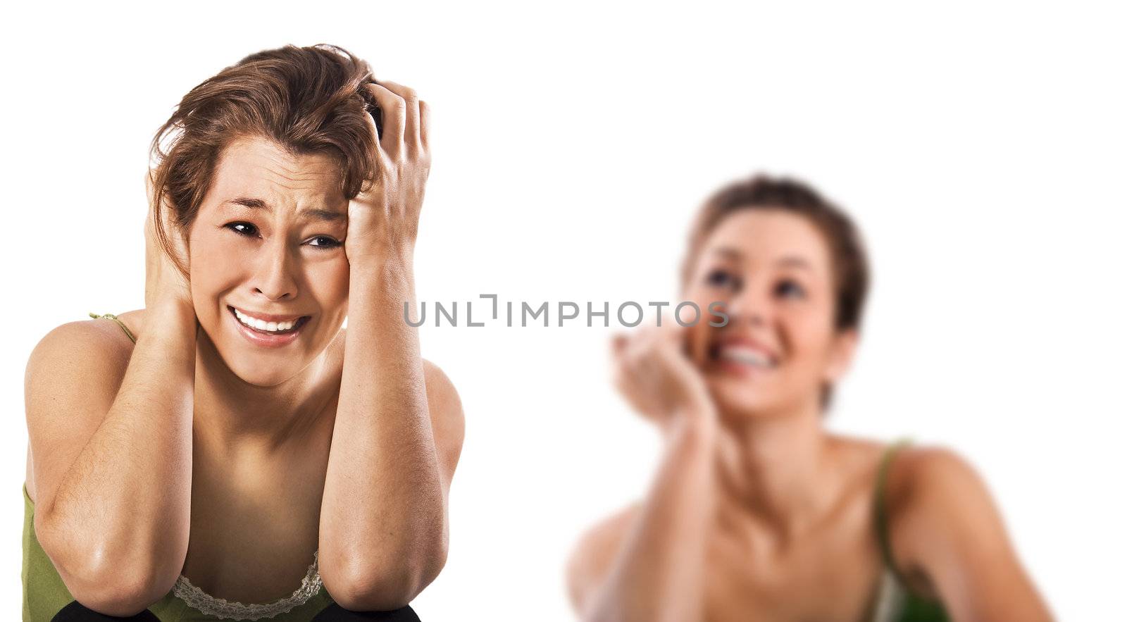 Contradiction - a happy smiling and a unhappy depressed woman