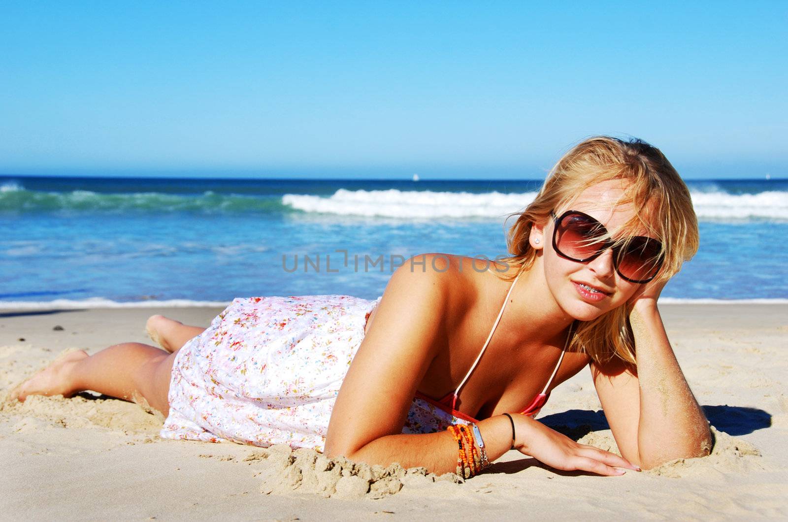 Young woman enjoying summer on the beach