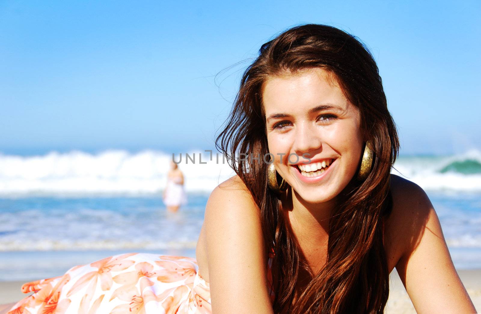 Young woman enjoying summer on the beach