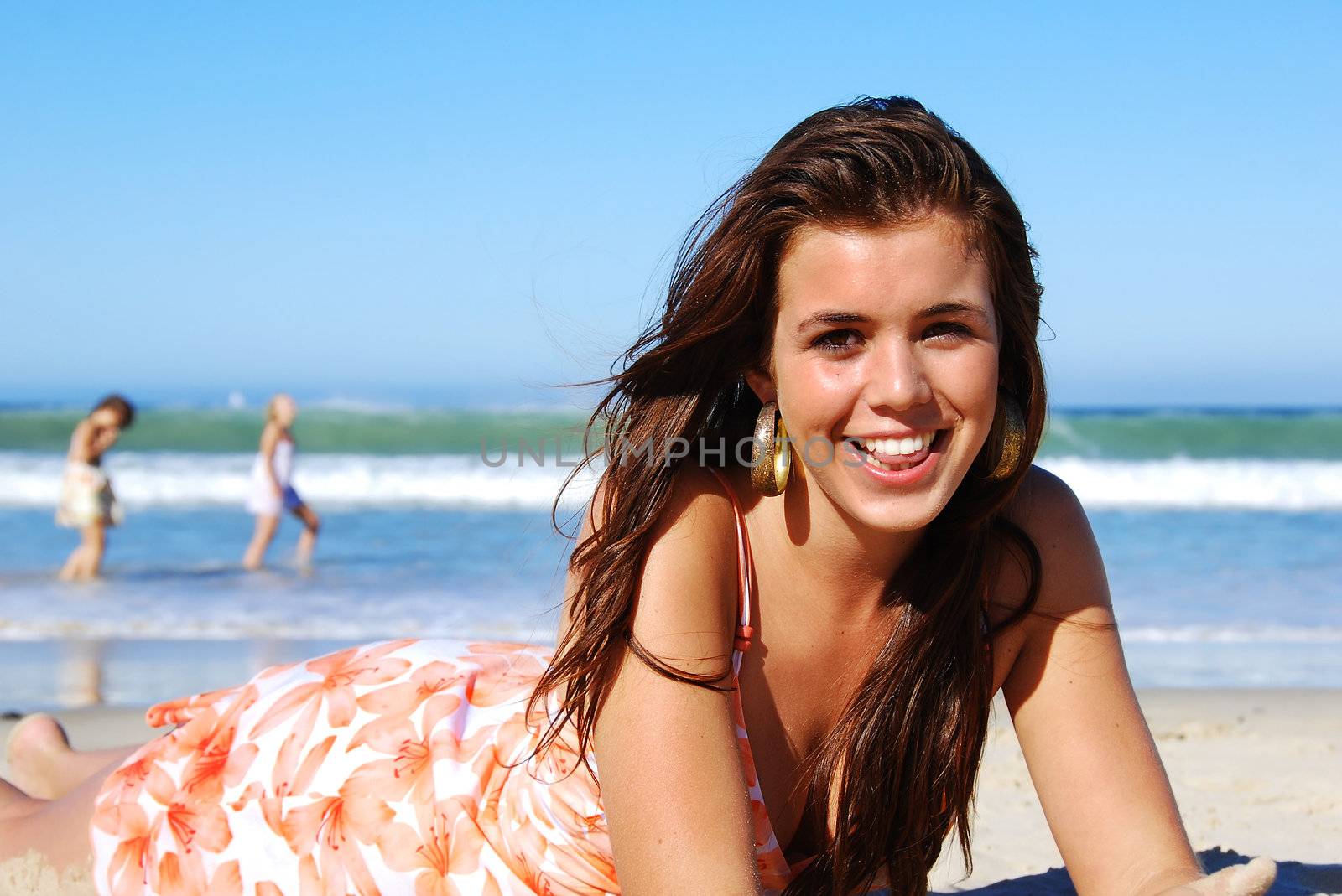 Young woman enjoying summer on the beach