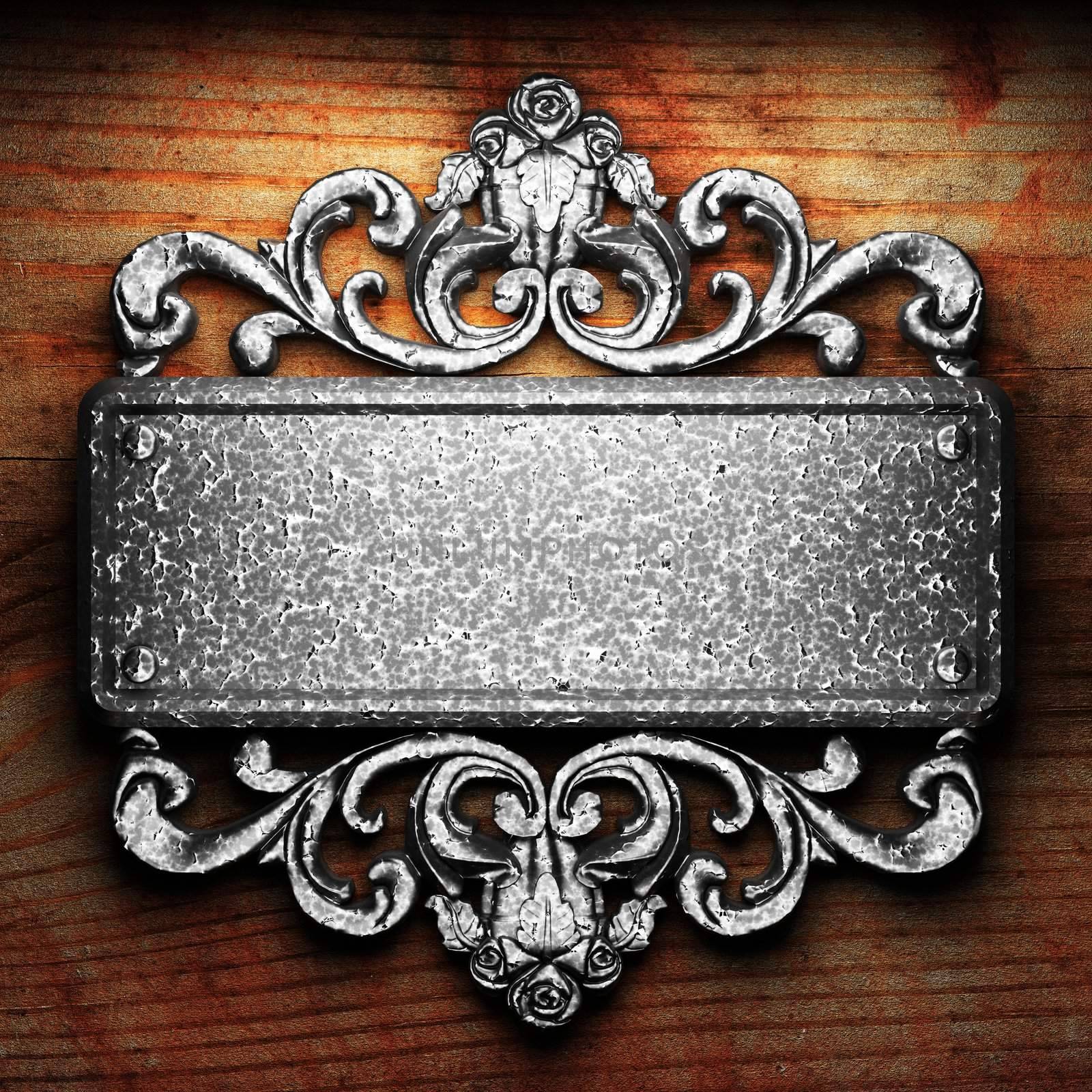 iron ornament on wood by icetray