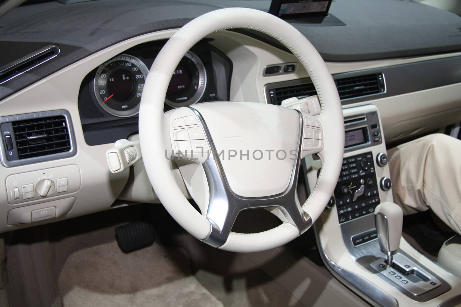 A white leather dashboard of a contemporary car