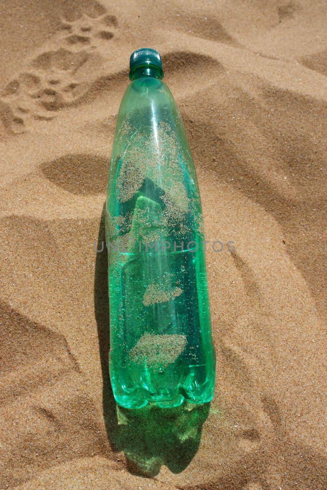 water bottle at the beach on a hot day