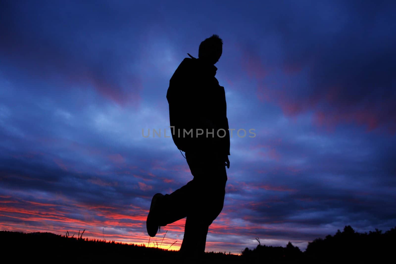 Person infront of nice clouds in the sky during the sundown