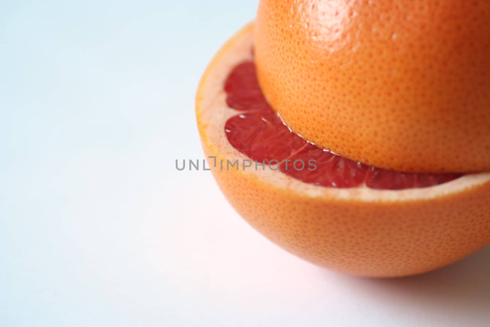Fresh and detailed picture of blood orange cut in halves. Copy space.