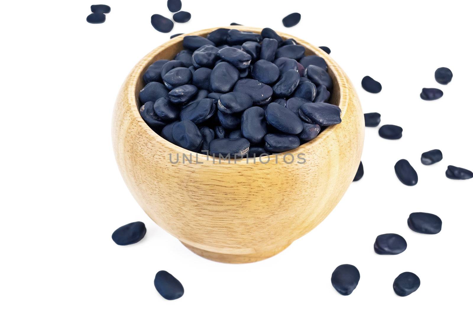Black beans in a wooden bowl by rezkrr