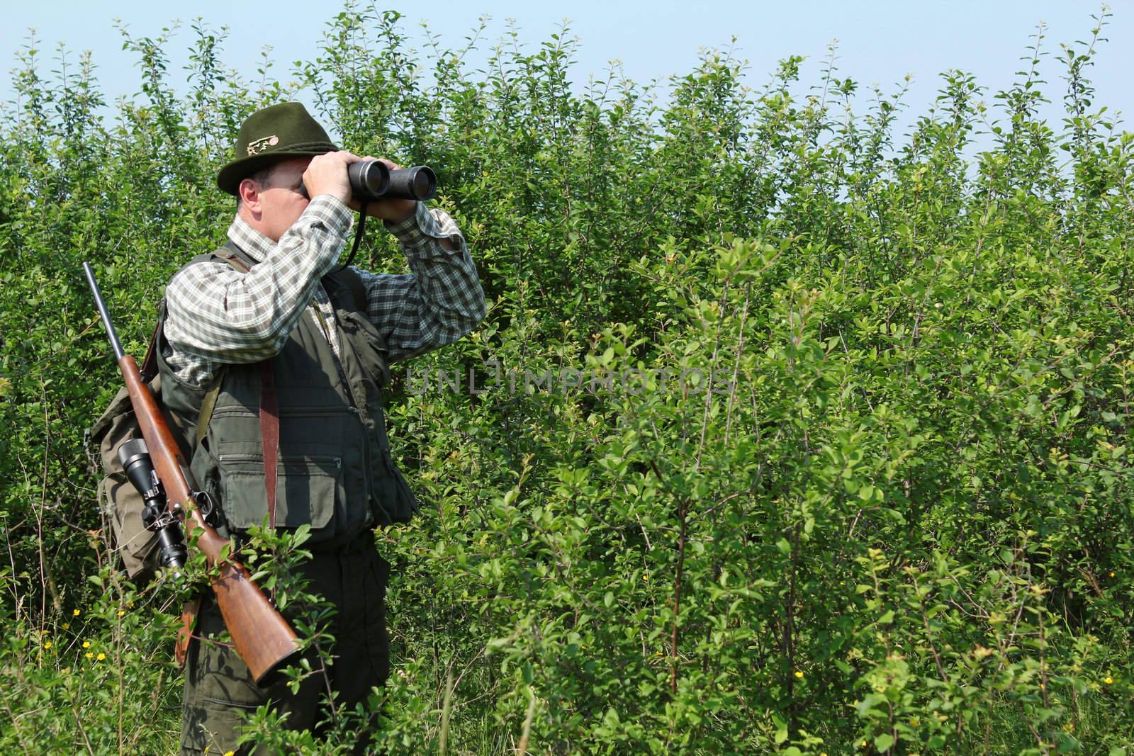 hunter with binoculars by goce