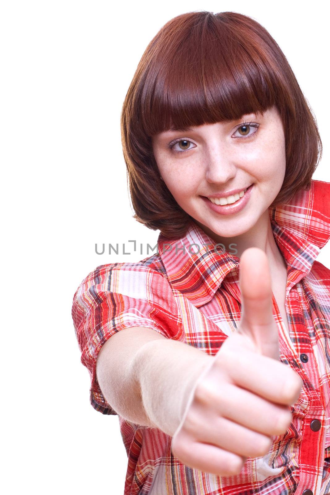 laughing girl in a shirt giving thumbs-up on a white background