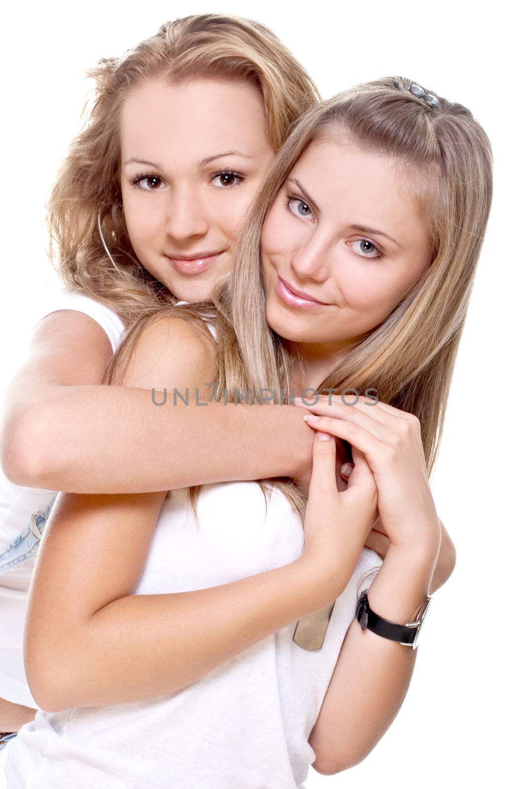 two beautiful women in a white T-shirts on a white background isolated