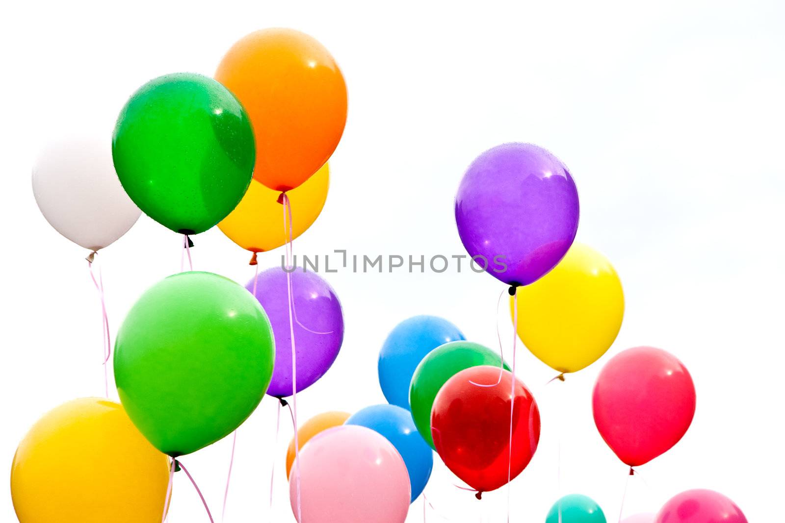 party balloons are a group in the sky as a background