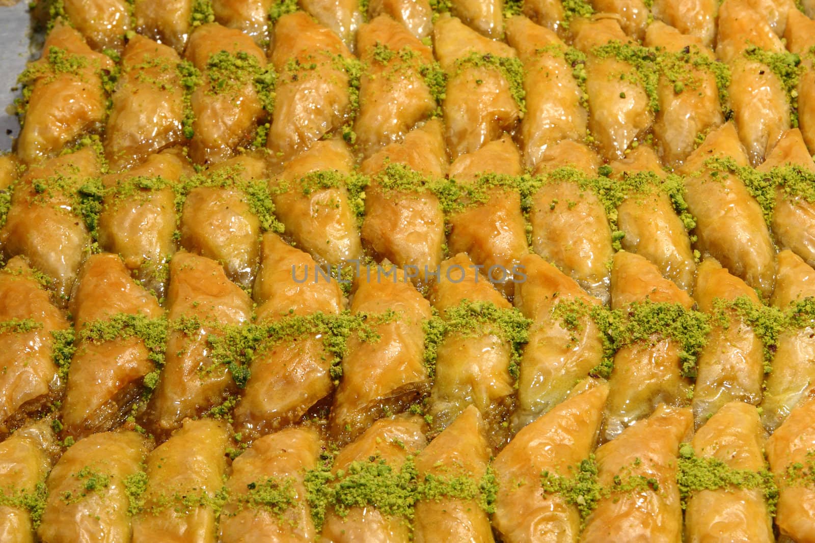 Fresh triangle baklava with pistachio and honey