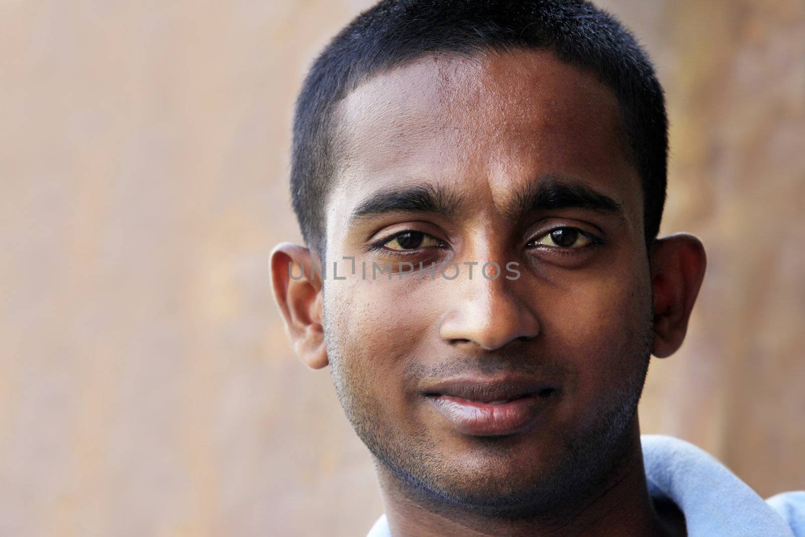 Closeup portrait of young man of Asian with smile