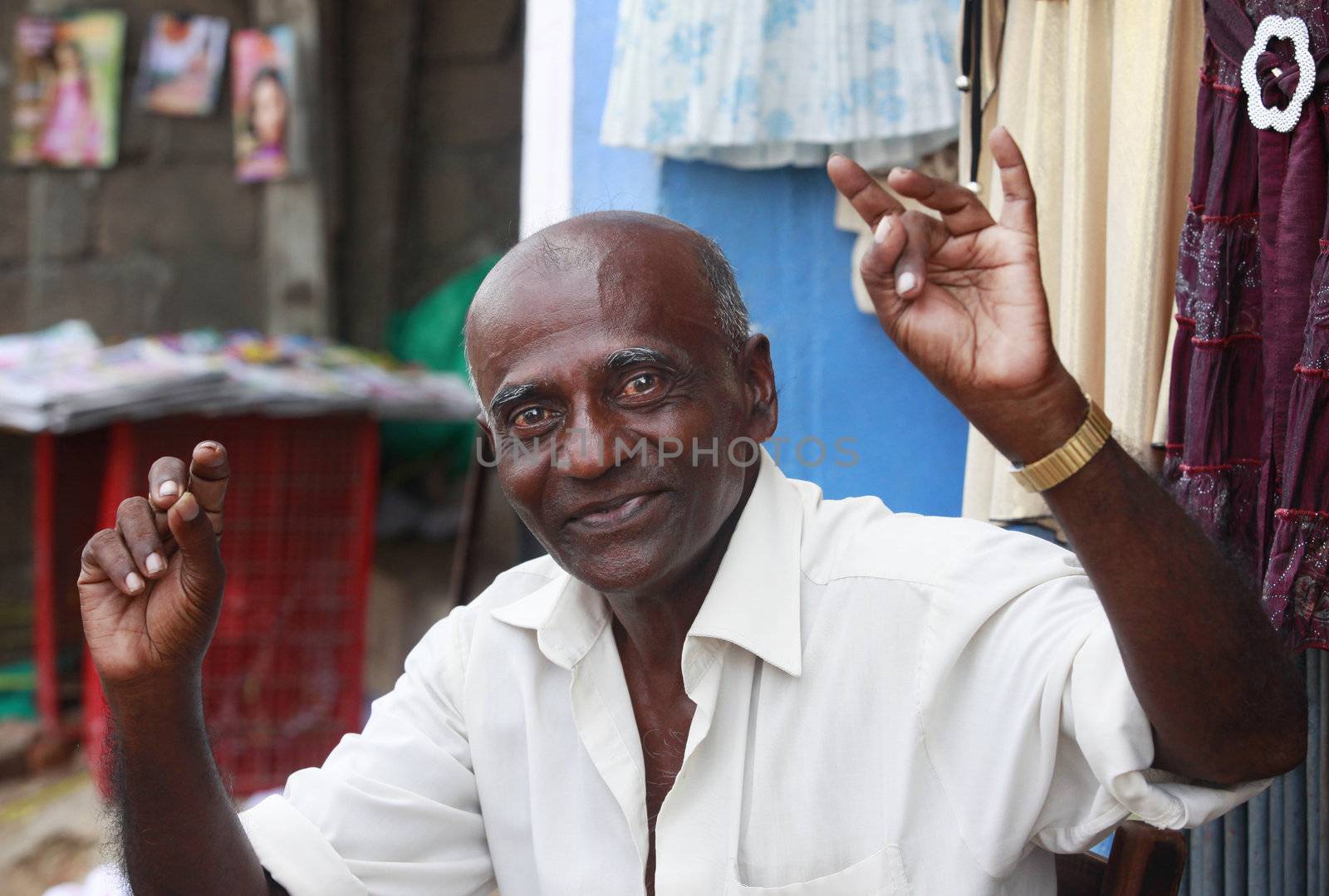 KALATURA, SRI LANKA 09 APRIL 2011: Cheerful elderly the man in the street city Kalatura 9 April 2011 on Sri Lanka