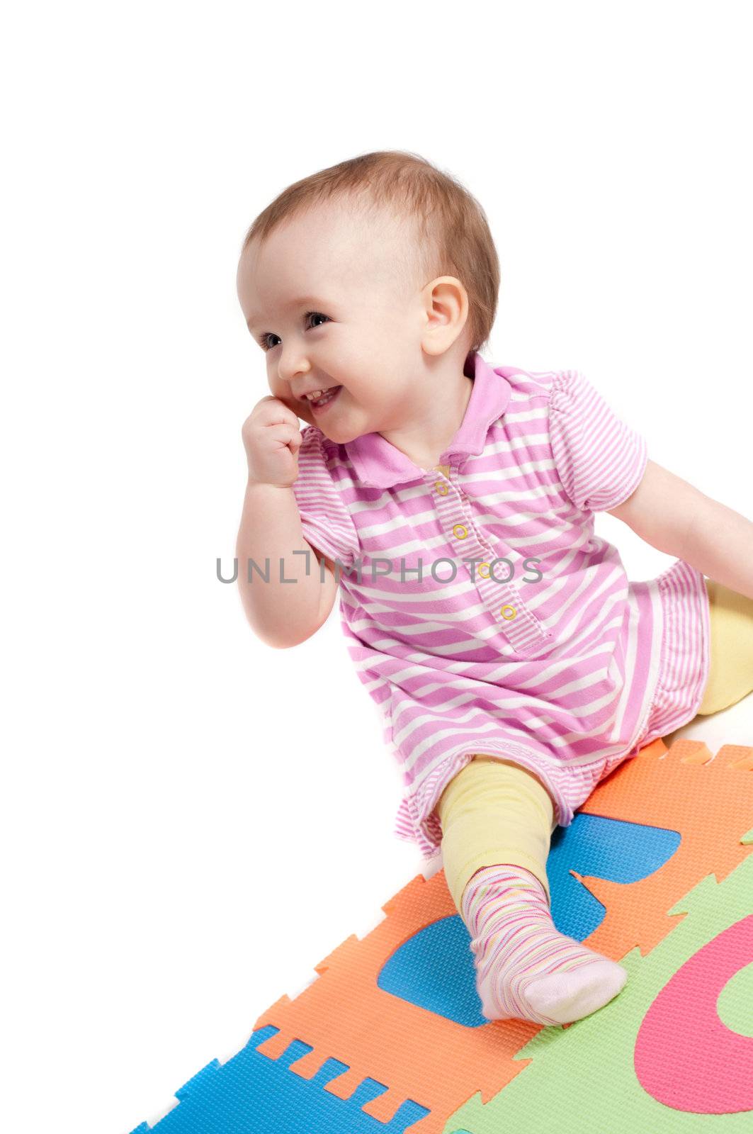 Shot of little cute baby playing with letters