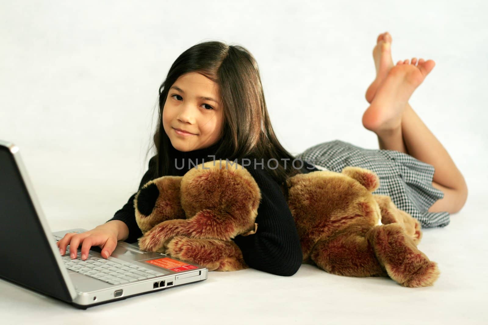 Eight years old girl on laptop