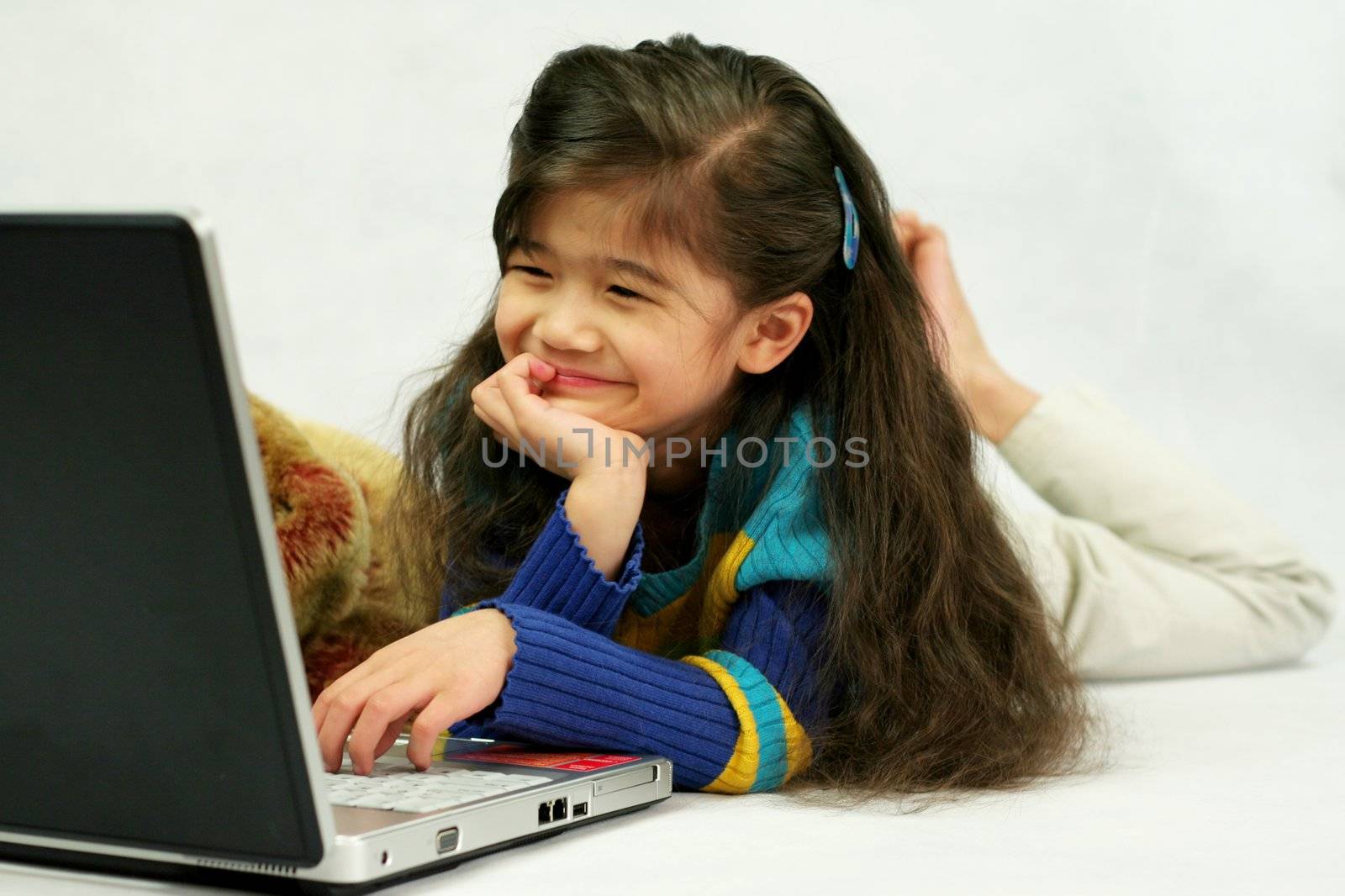 Five year old playing on laptop