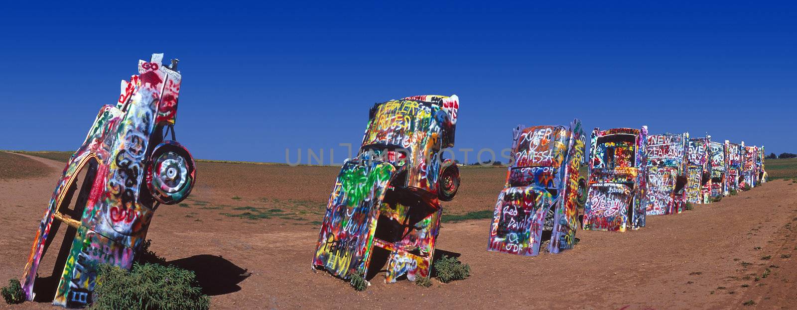 painted cars sticking out the ground at Cadillac Ranch in Amarillo, Texas