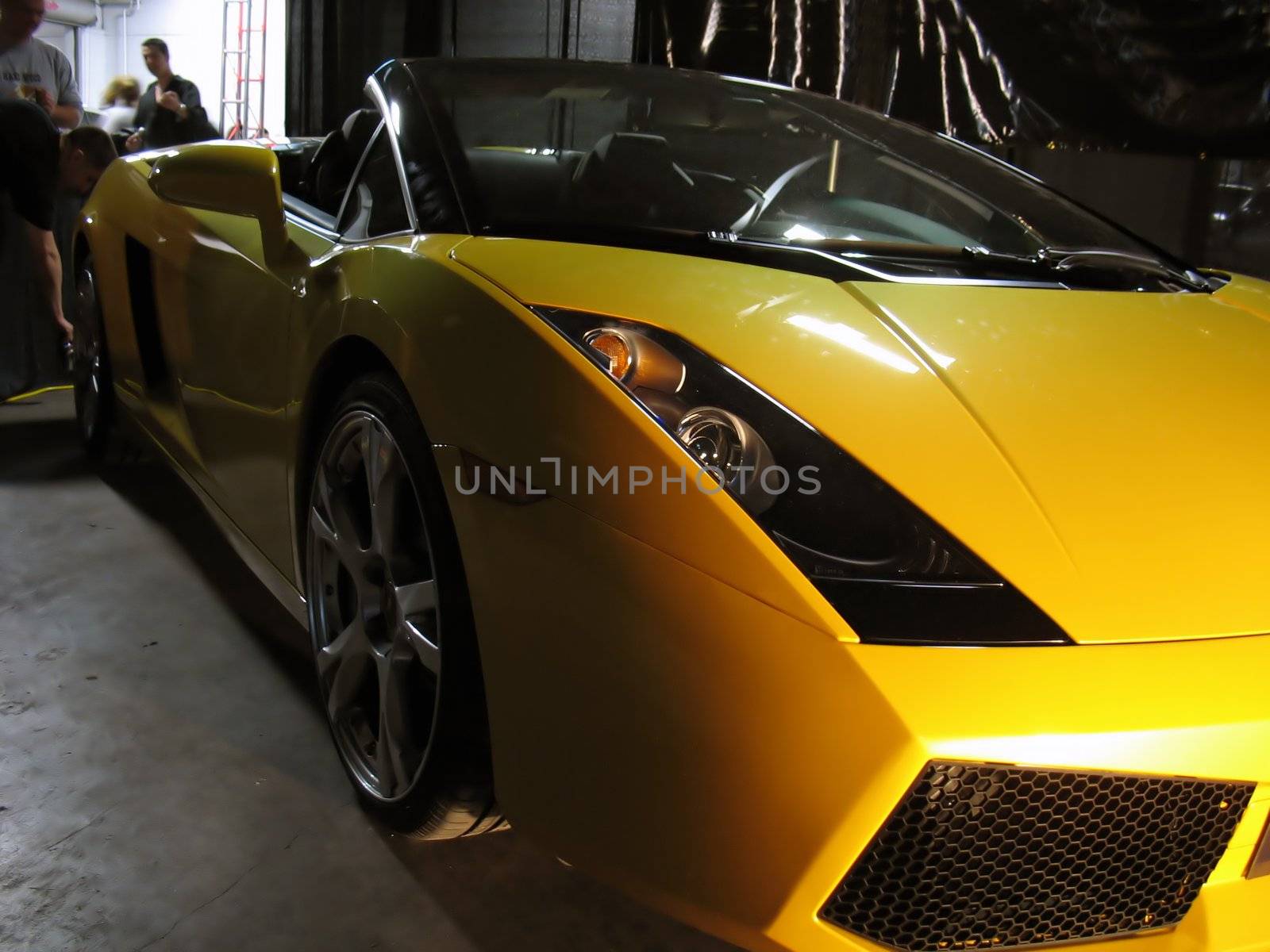 An exotic yellow sports car.