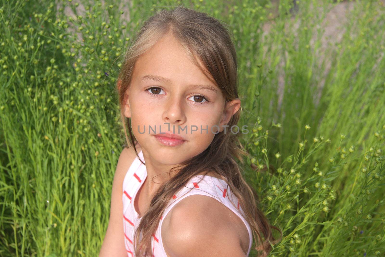 A 10 year old girl looking at the camera