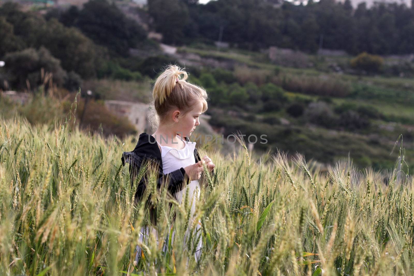 Girl looking at the view in a field