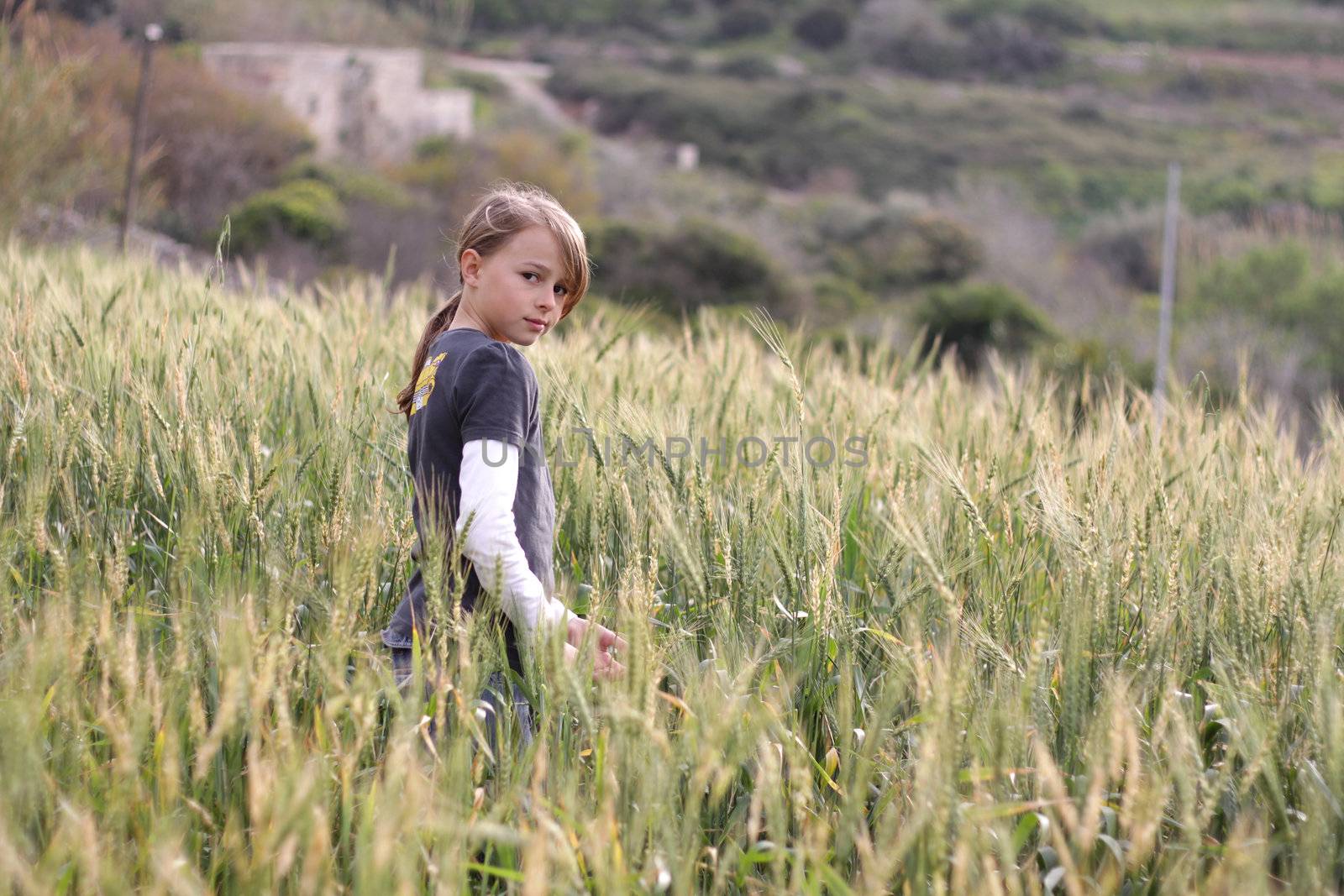 Young girl in a field by annems